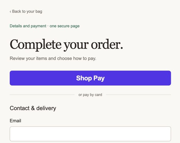 Example merchant checkout showing a Shop Pay button and contact form